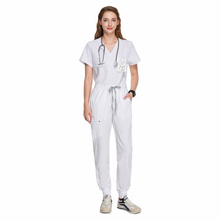 white medical scrub uniform on a woman, short sleeved top with v-neck and medical scrub pants with ribbed ankle cuffs, high waisted with adjustable drawcord