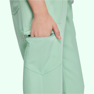 grayed jade or light green medical scrub pants with zipper pocket on leg